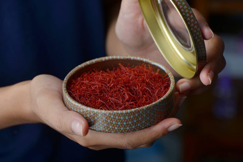 Premium saffron threads in a decorative container
