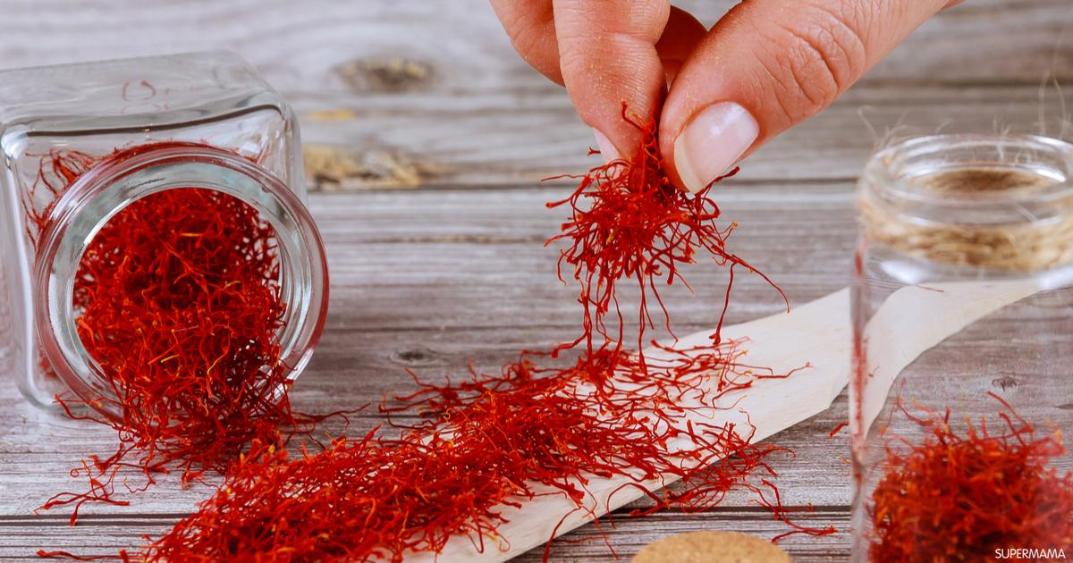 Red saffron threads being handled